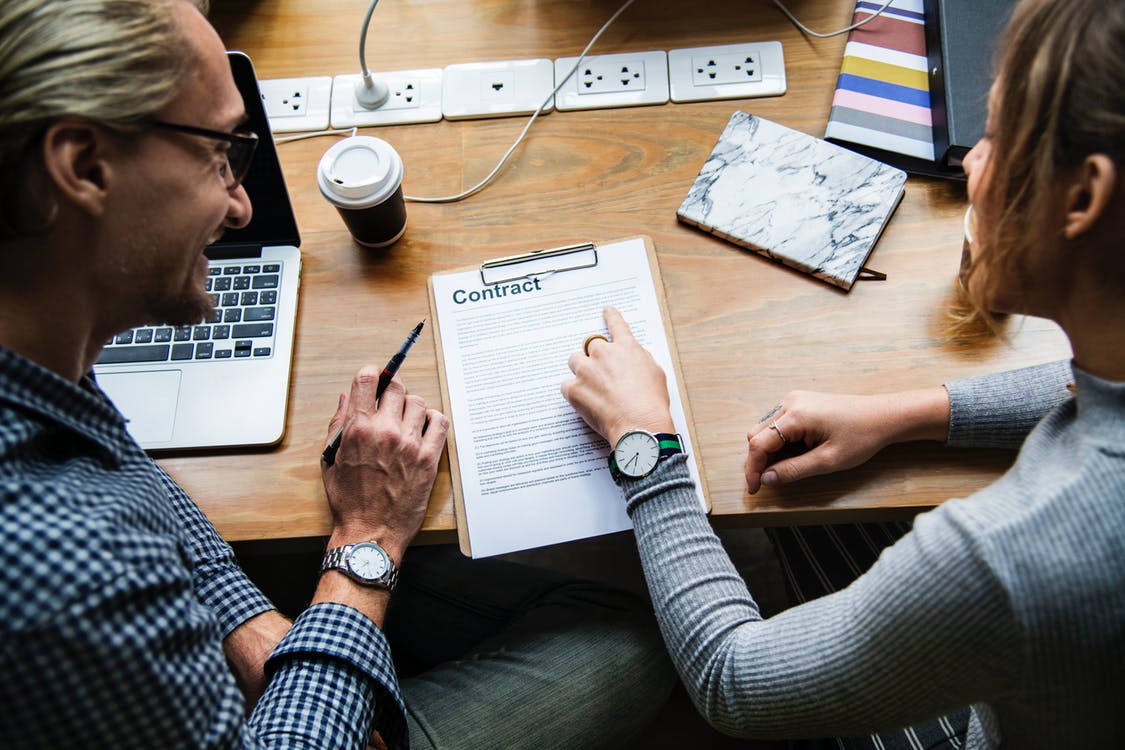 Couple Signing Paper | Personal Injury